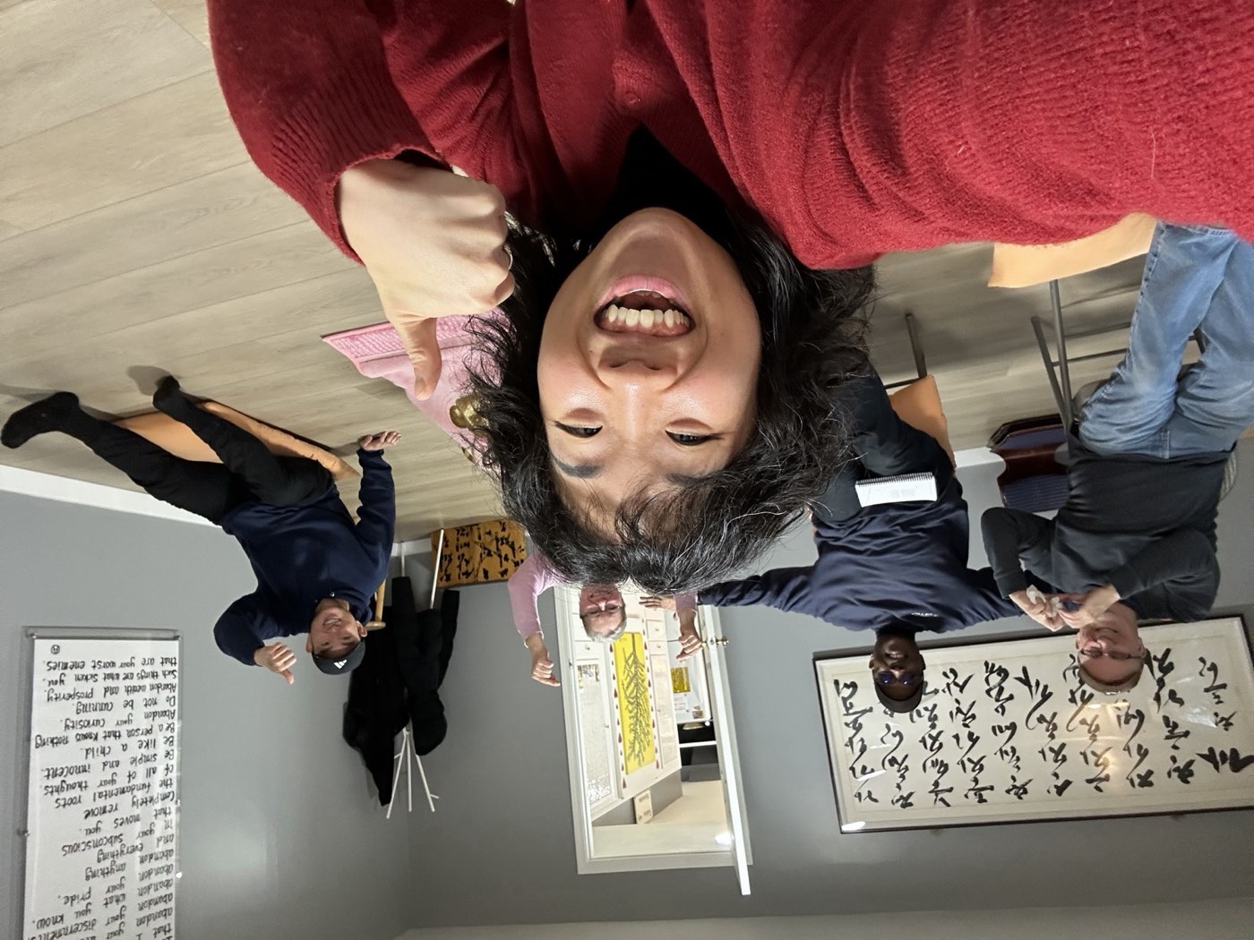 A guide and members smiling together in the meditation room