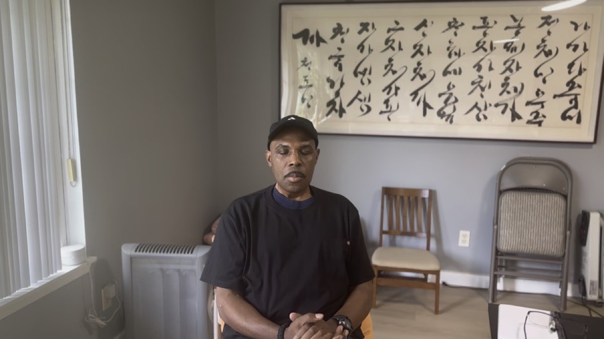 A member meditating in the room at the center